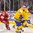 BUFFALO, NEW YORK - DECEMBER 26: Sweden's Jesper Sellgren #23 controls the puck against Sergei Pishuk #14 of Belarus during the preliminary round of the 2018 IIHF World Junior Championship. (Photo by Andrea Cardin/HHOF-IIHF Images)

